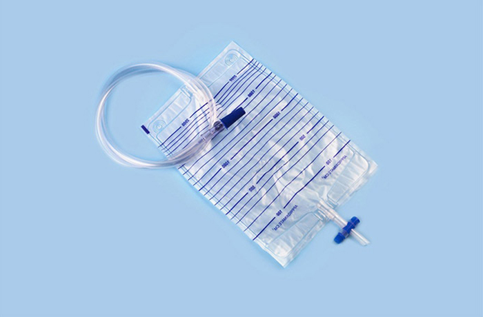 Two-way urine bag (with a check valve at the upper end, a silica gel sampling port, and a cross drain valve at the lower end)