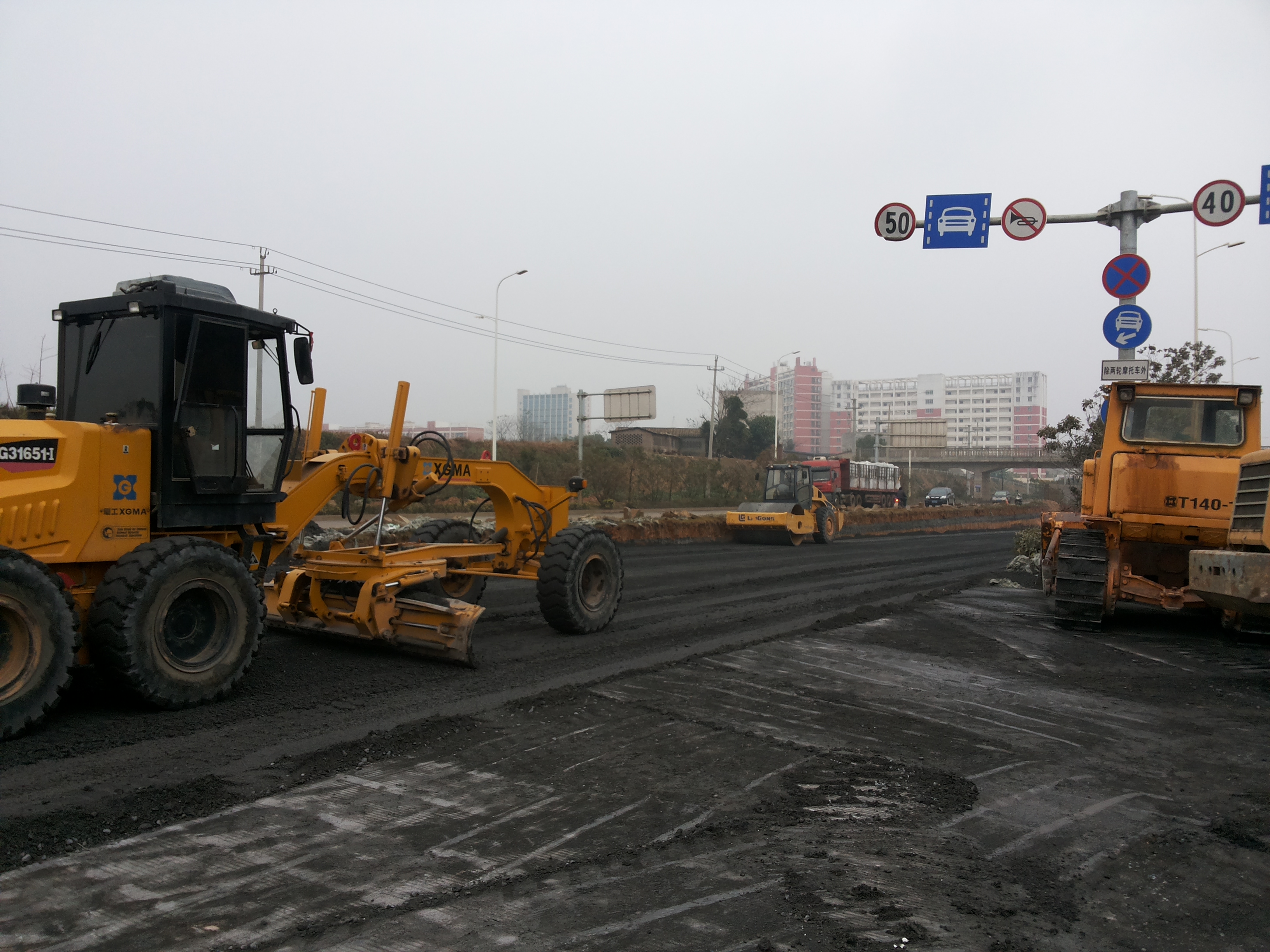 Pavement construction site at the base of Tieshangang No.4 Road overpass in Beihai