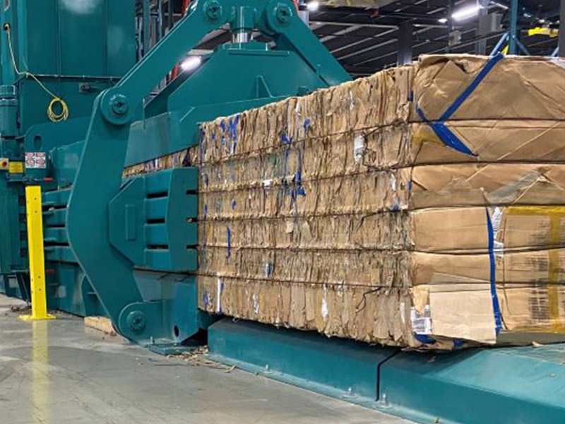 Is the power of waste paper packer provided by hydraulic pump or by the machine itself?